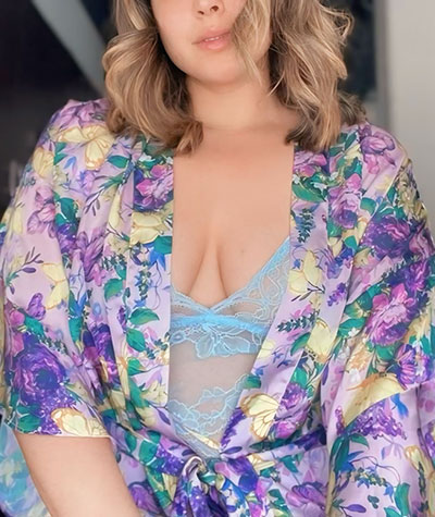 Maddy looks gorgeous while showing off her figure and wearing a, purple and blue floral robe with sexy blue lace lingerie.